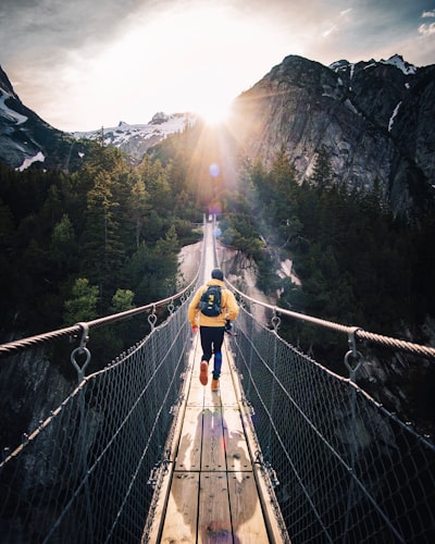 We were at this beautiful brige in murren , in the bernese Oberlan in switzerland with some friend, when i tell my friend to run like if he would catch the last ray.