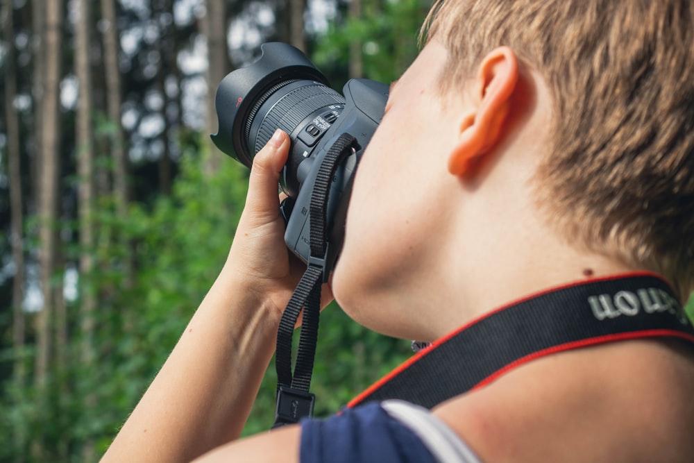 person taking photo using camera