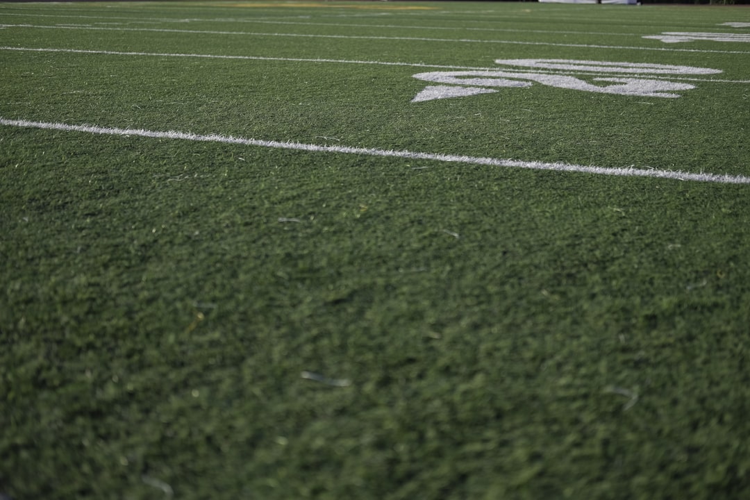 green and white football field,
