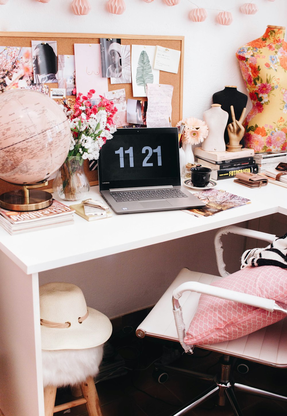 turned-on silver laptop on white wooden table