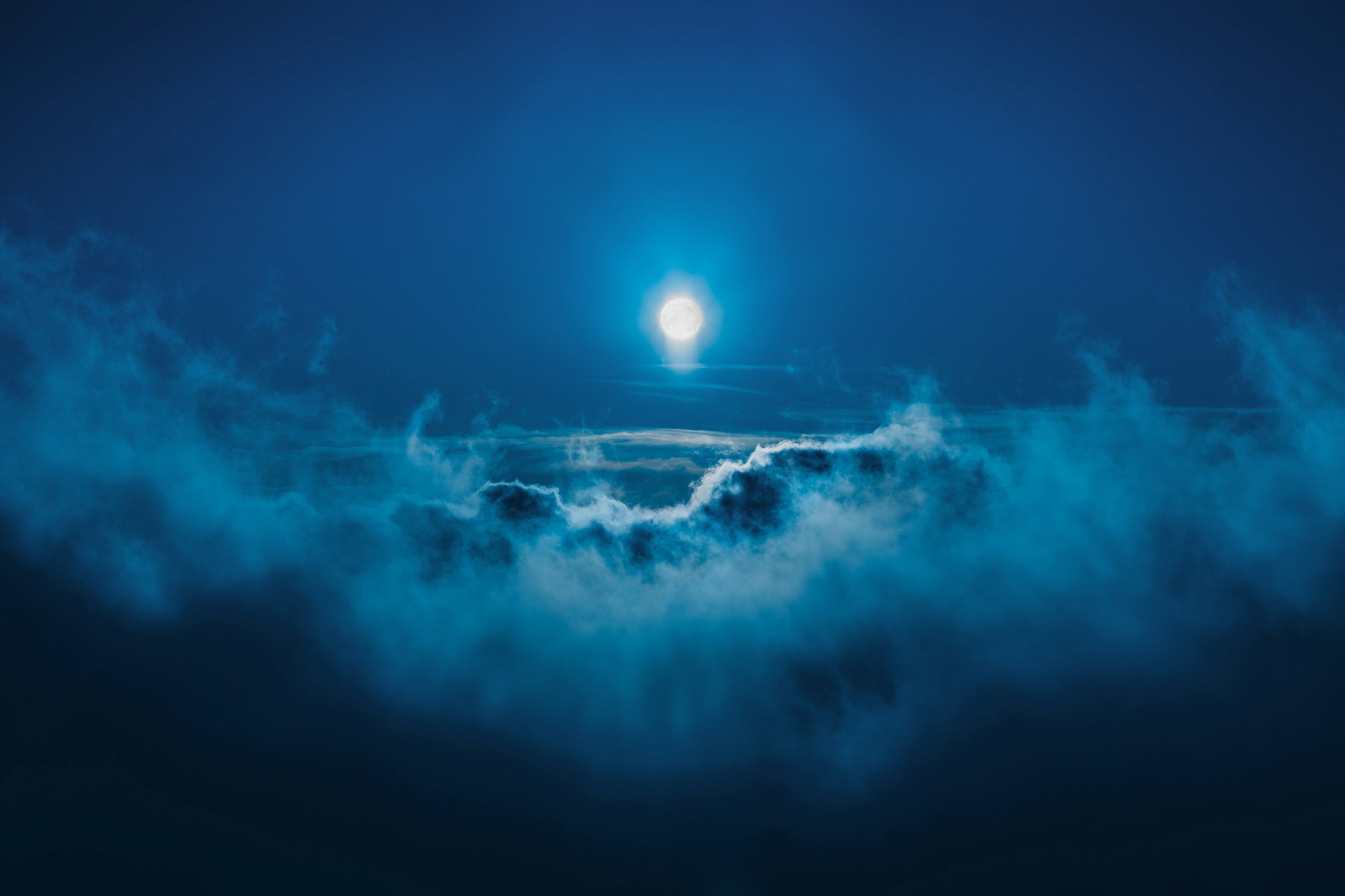 full moon along clouds