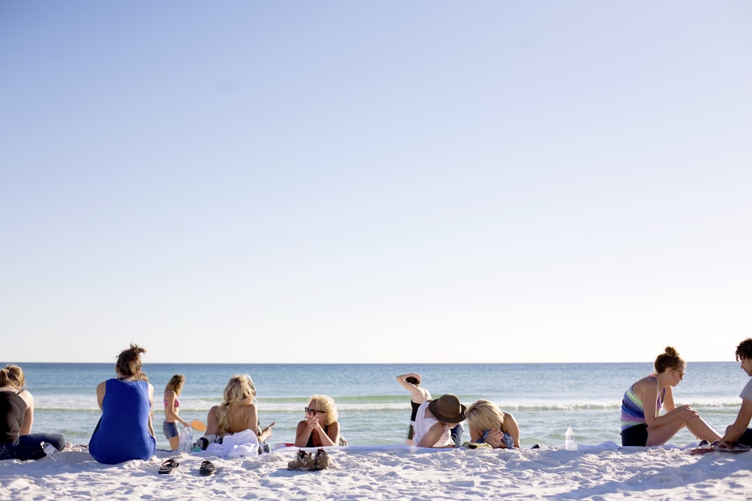 people on white sands by the beach, My friends Angie and Josh gathered all their people in one place for a long weekend 