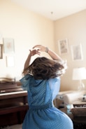 girl twirling around room