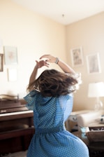 girl twirling around room