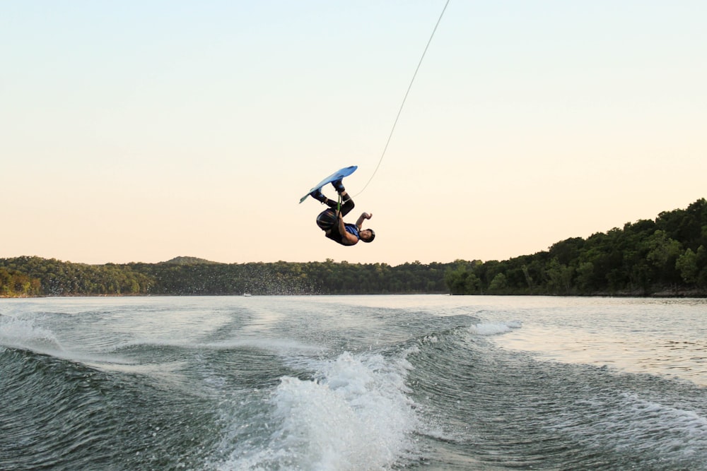 man surfing on waves