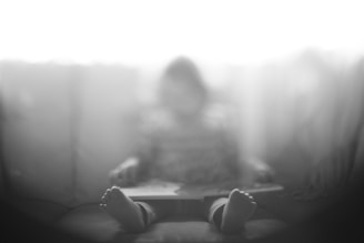 child sitting on chair