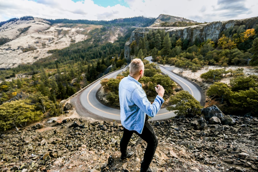 man on top of hill