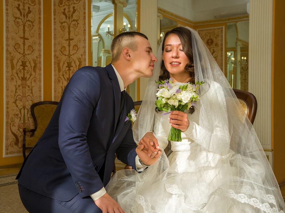 bride and groom holding hands together indoors