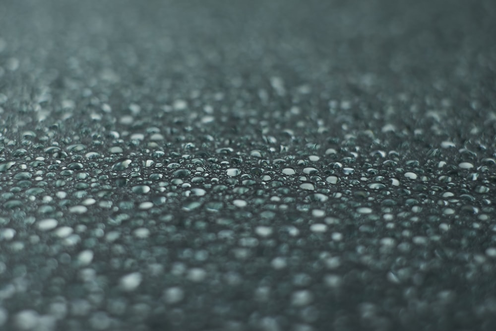 a close up of water droplets on a surface