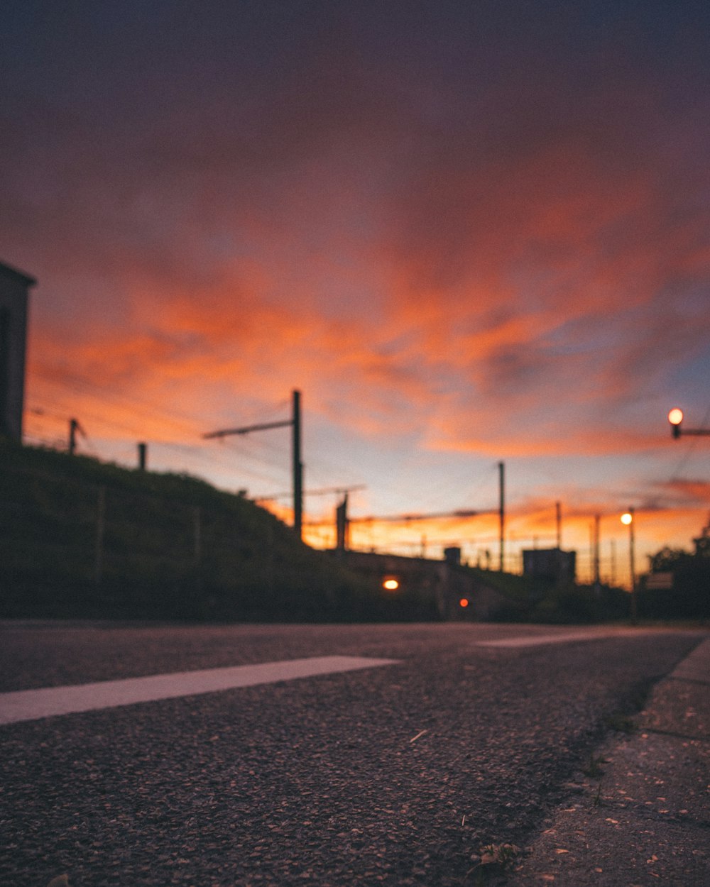 selective focus golden house photography of concrete road near buildings