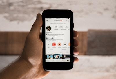 person holding space gray iPhone 6
