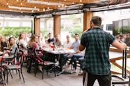 man standing infront of group of people