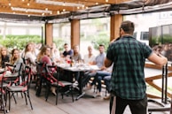 man standing infront of group of people