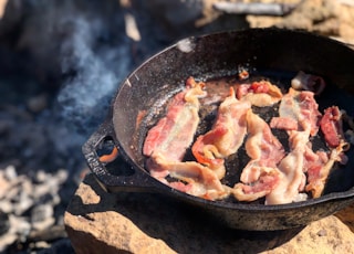 fried bacon in frying pan