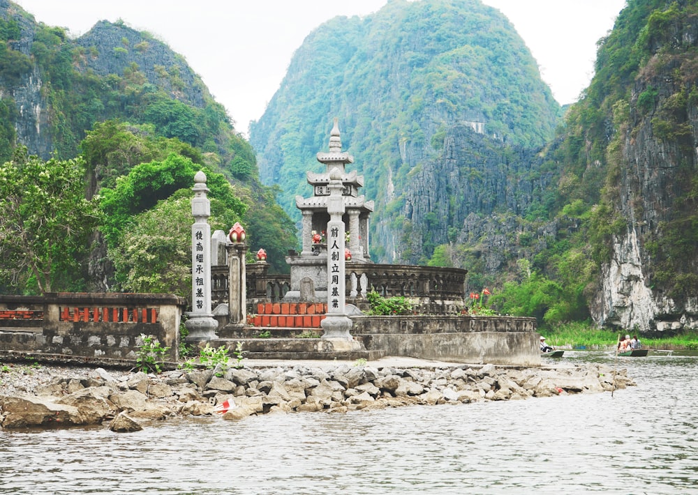 gray concrete altar near body of water