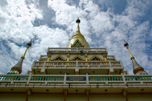 The grand facade of ISKCON Delhi temple shining under the sun.