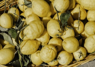 yellow fruits on brown basket