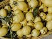 yellow fruits on brown basket