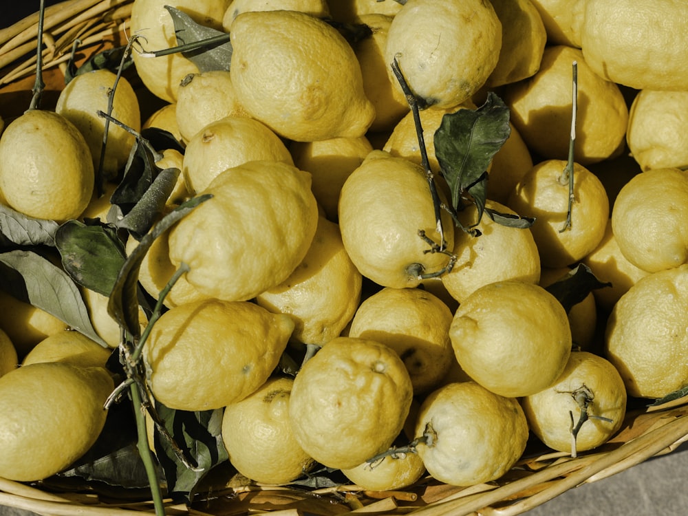 yellow fruits on brown basket