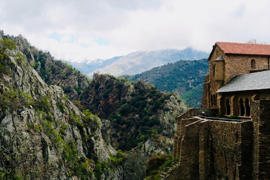 building near mountain in Abbaye Saint-Martin-du-Canigou France