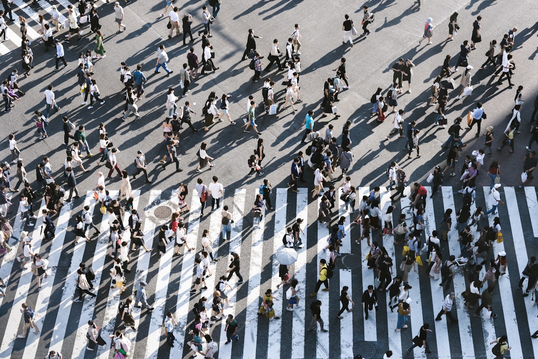 aerial view of people walking on raod, about 3000 people across the shibuya crossing at a time<p></figure>they look like army of ants from this point