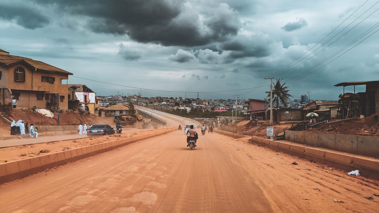 person riding on motorcycle Nigeria highway