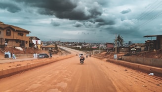 person riding on motorcycle Nigeria highway