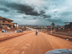 person riding on motorcycle Nigeria highway