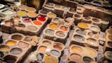 a table filled with lots of different colors of paint