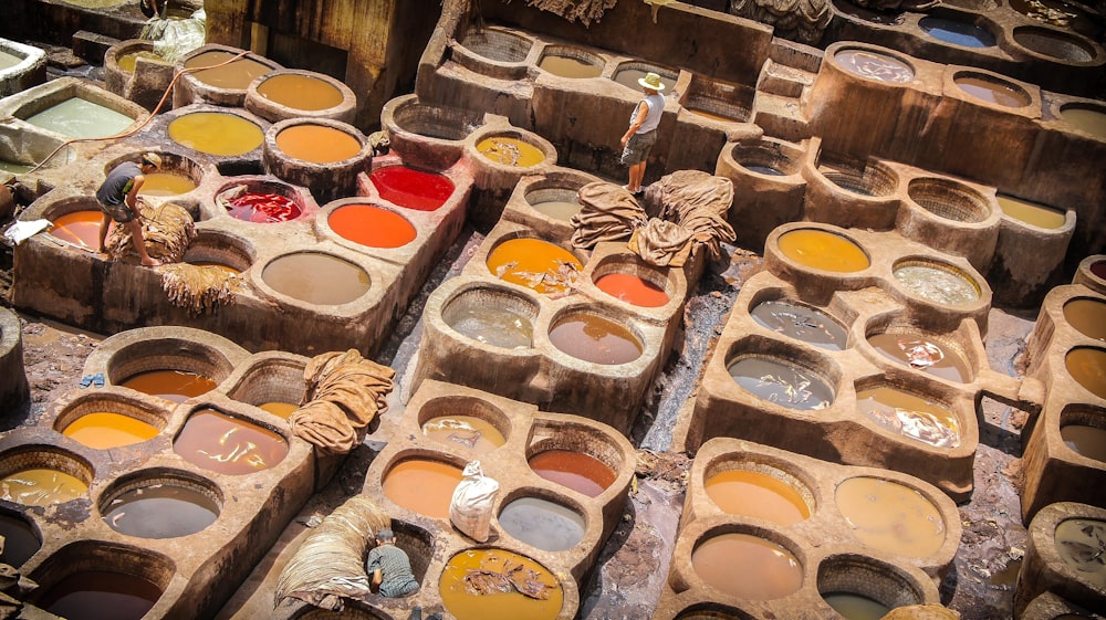 a table filled with lots of different colors of paint