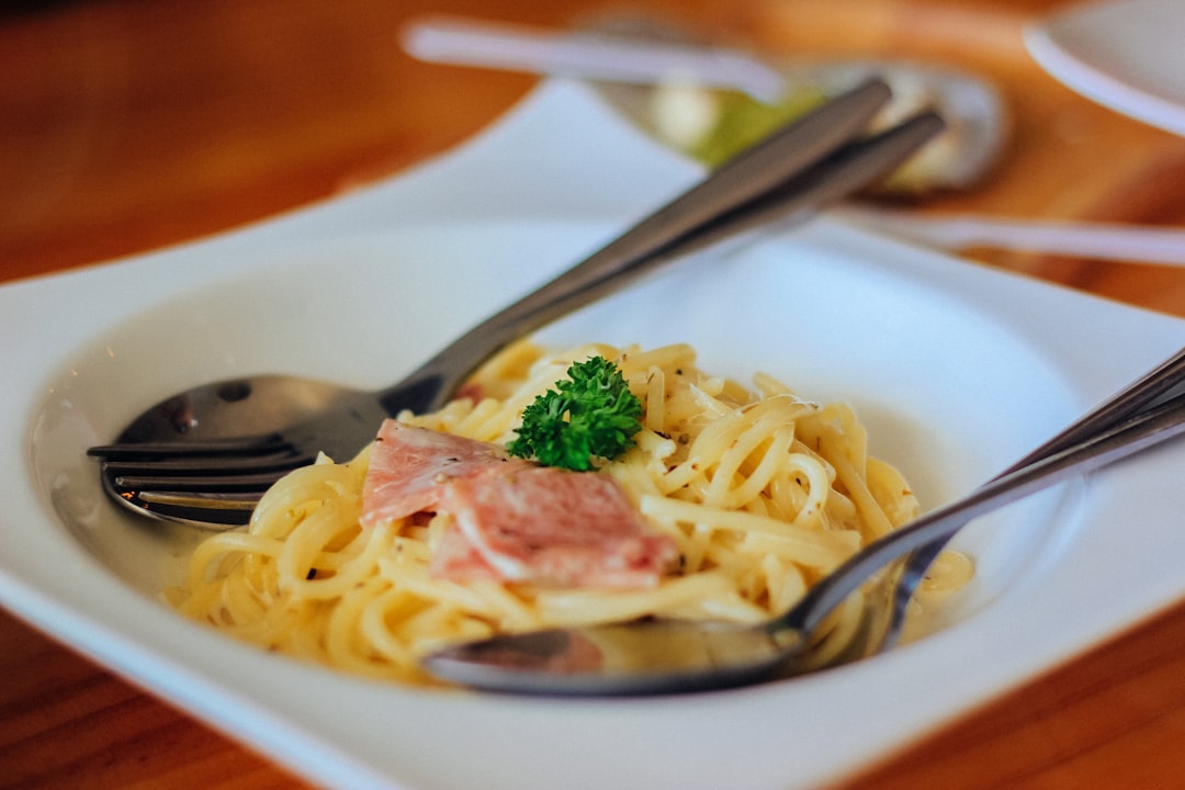 pasta with meat in white palte