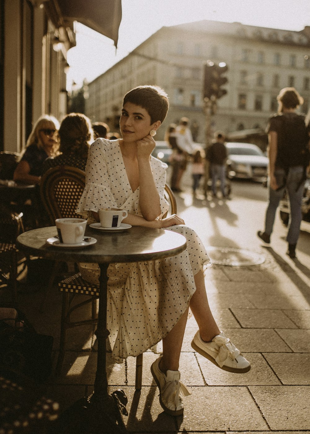 woman leaning on table in cafe