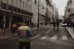 man standing in the middle of street