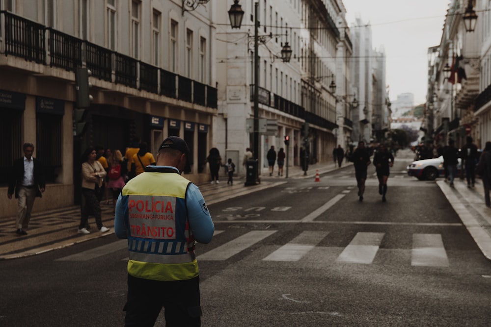 man standing in the middle of street