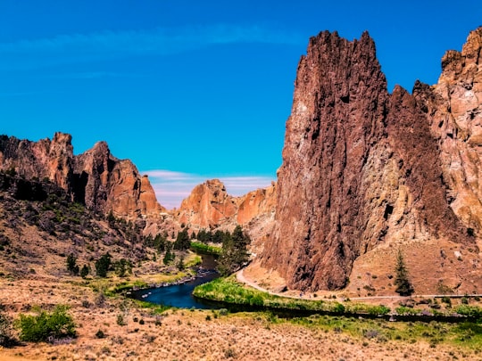 brown mountain under blue sky in Smith Rock State Park United States