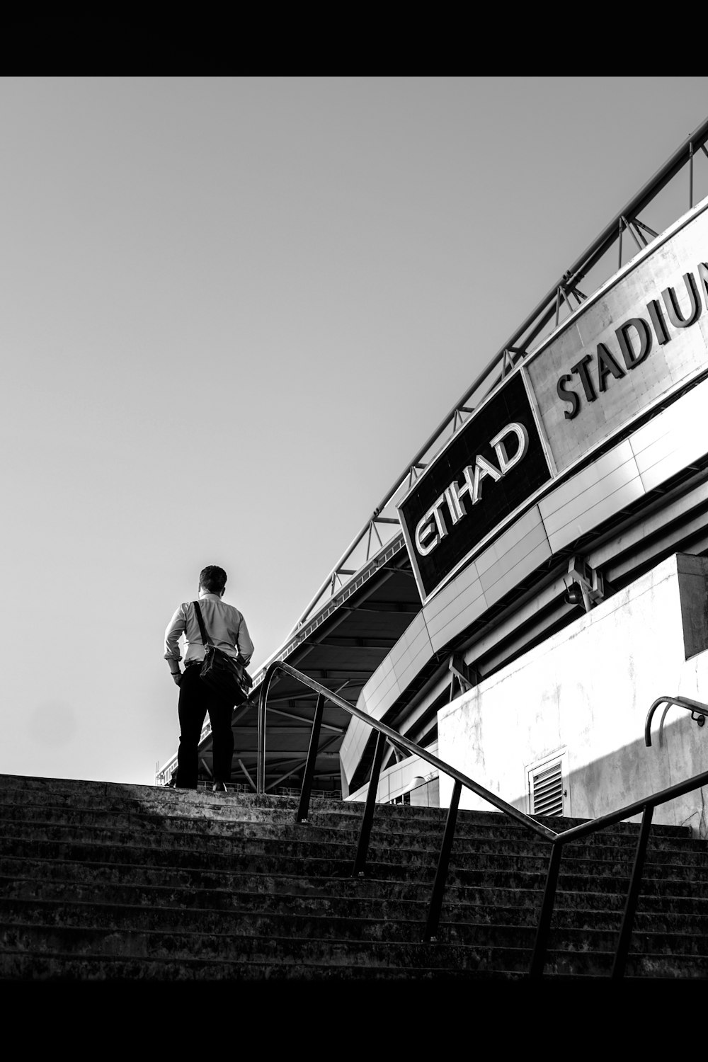 man standing on the top of the stairs