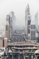 high-rise building with long winding road