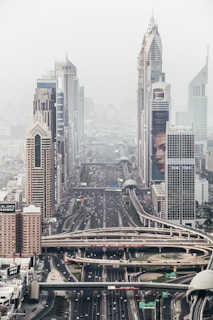 high-rise building with long winding road