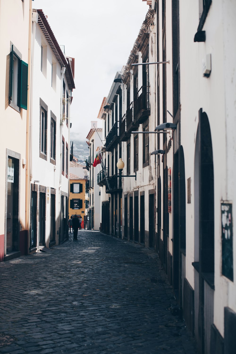 person standing in the middle of houses