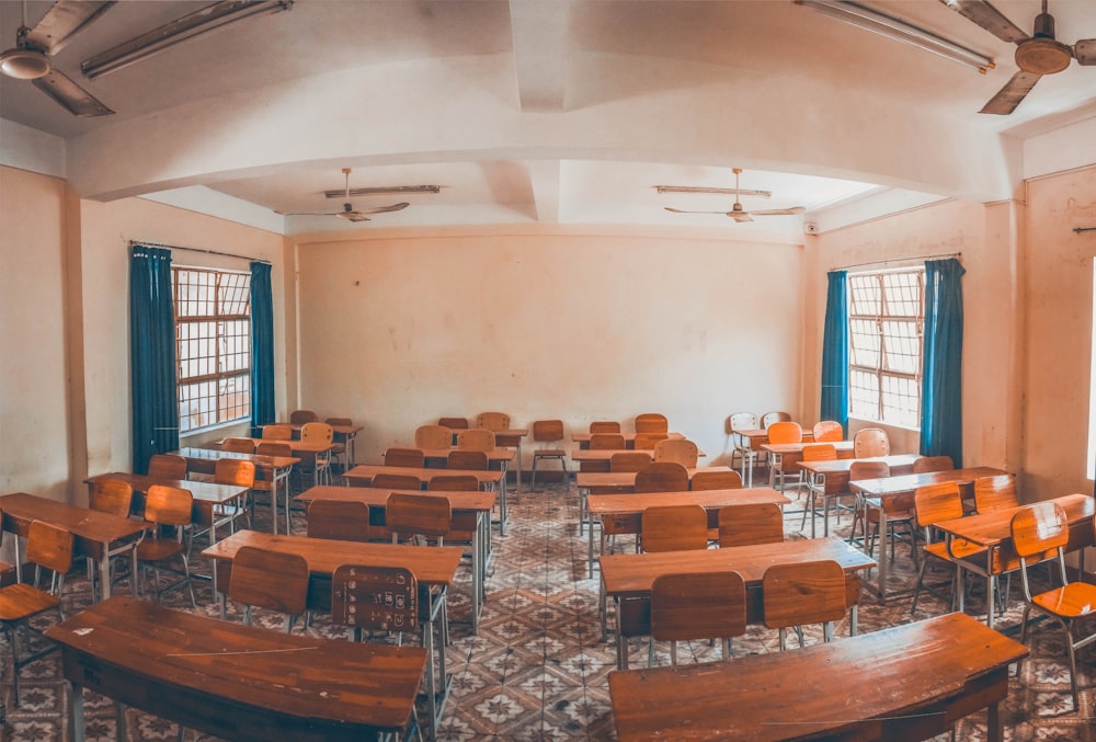 photo of brown wooden school desk