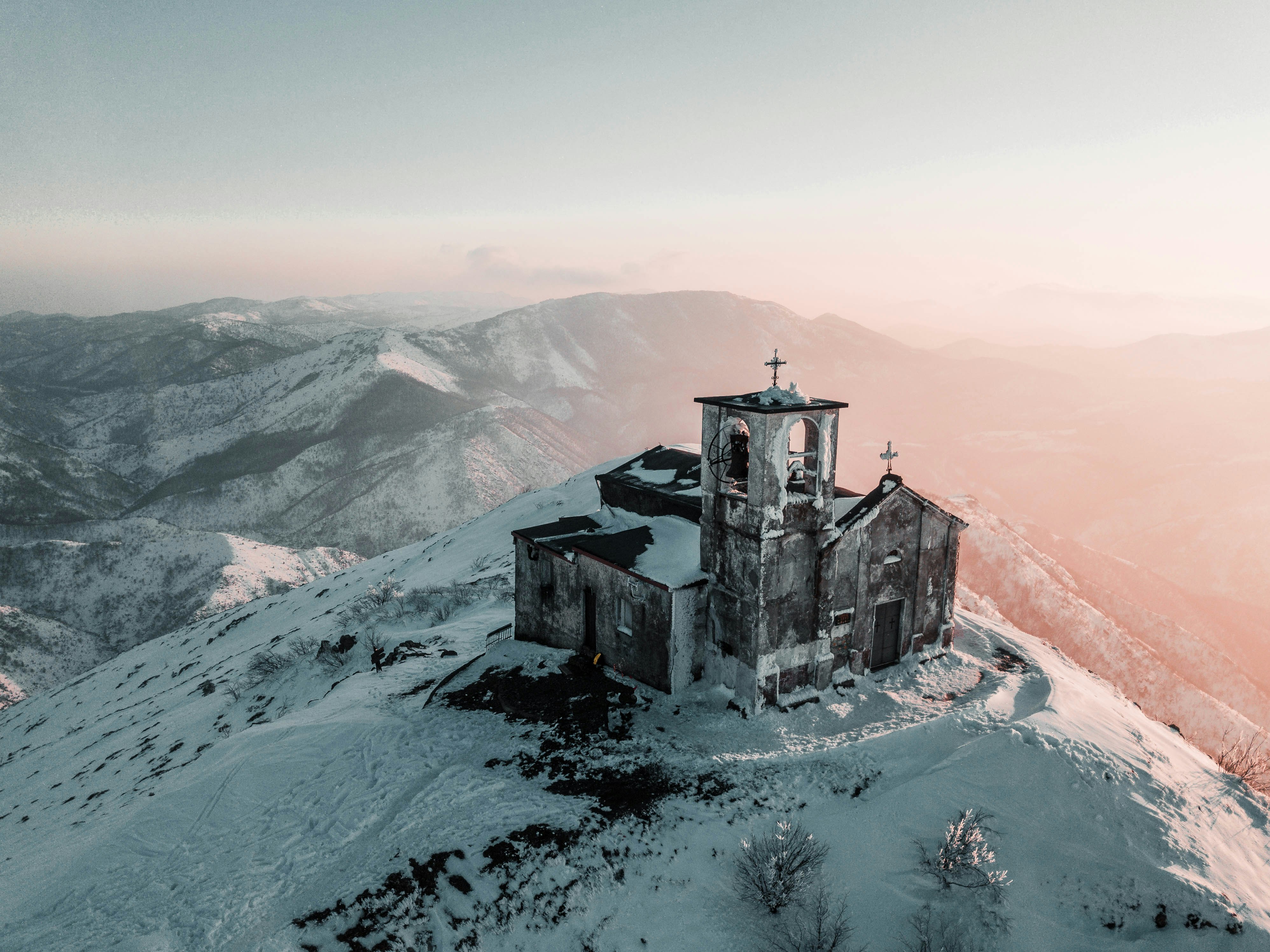 cathedral covered by snow on top of the mountain