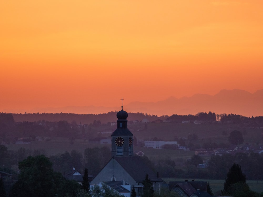 silhouette of gray building during golden hour