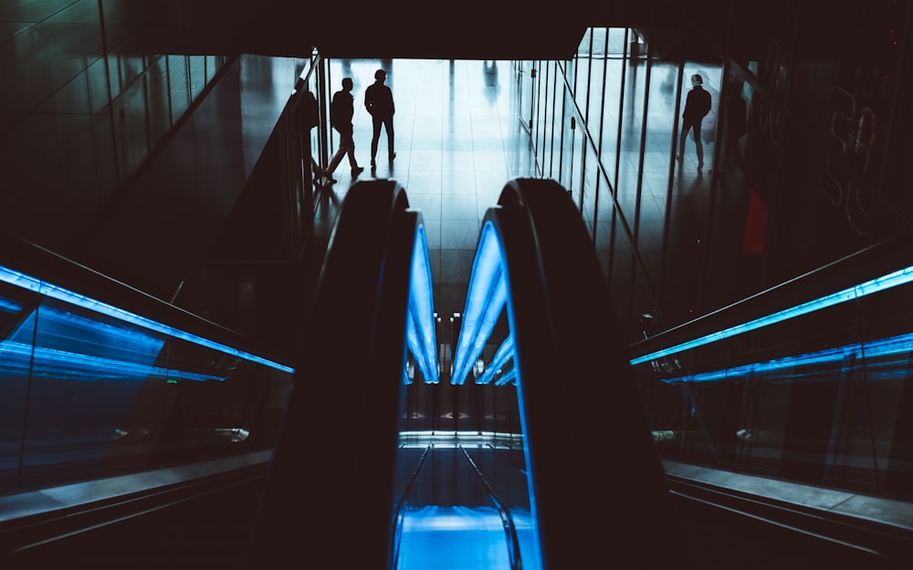 silhouette of two people walking in the hallway