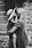 grayscale photography of woman carrying girl