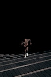 man running on staircase