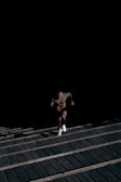 Motivated person running up stairs as training.