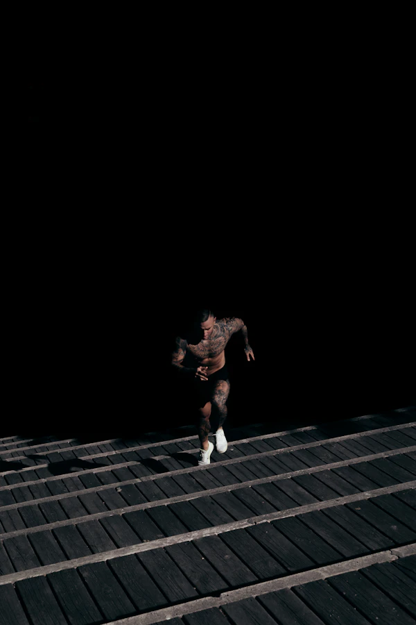 Dark moody gym with iron plates and bars