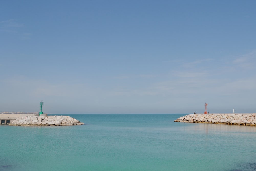 body of water between concrete docks