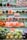 A supermarket shelf displays an array of fresh vegetables neatly organized in clear plastic packaging. The shelves are filled with vibrant, fresh produce, including carrots, peppers, broccoli, lettuce, cauliflower, and more. A discount sign offers 10% off, drawing attention to the vibrant selection.