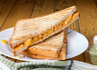 bread with cheese fillings on white ceramic plate